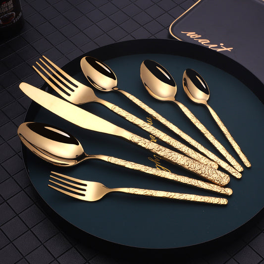 Cutlery with embossed textured handle